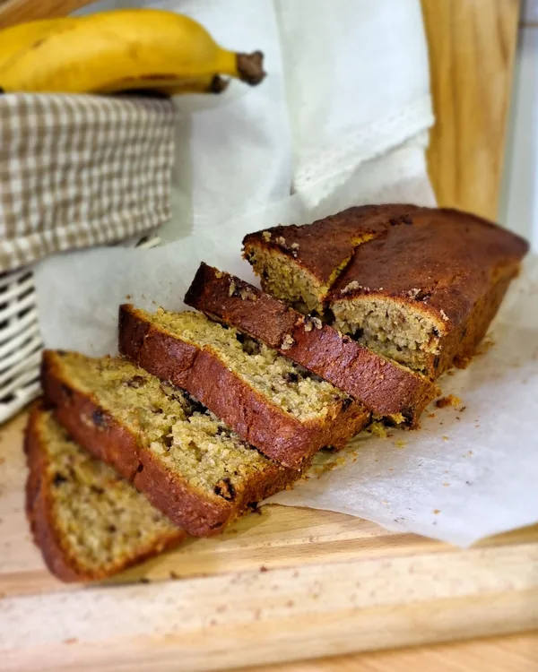 Sliced banana walnut bread on a board