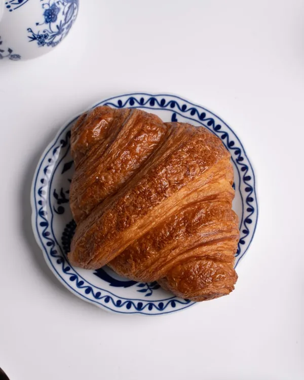 Croissant on a blue-and-white plate